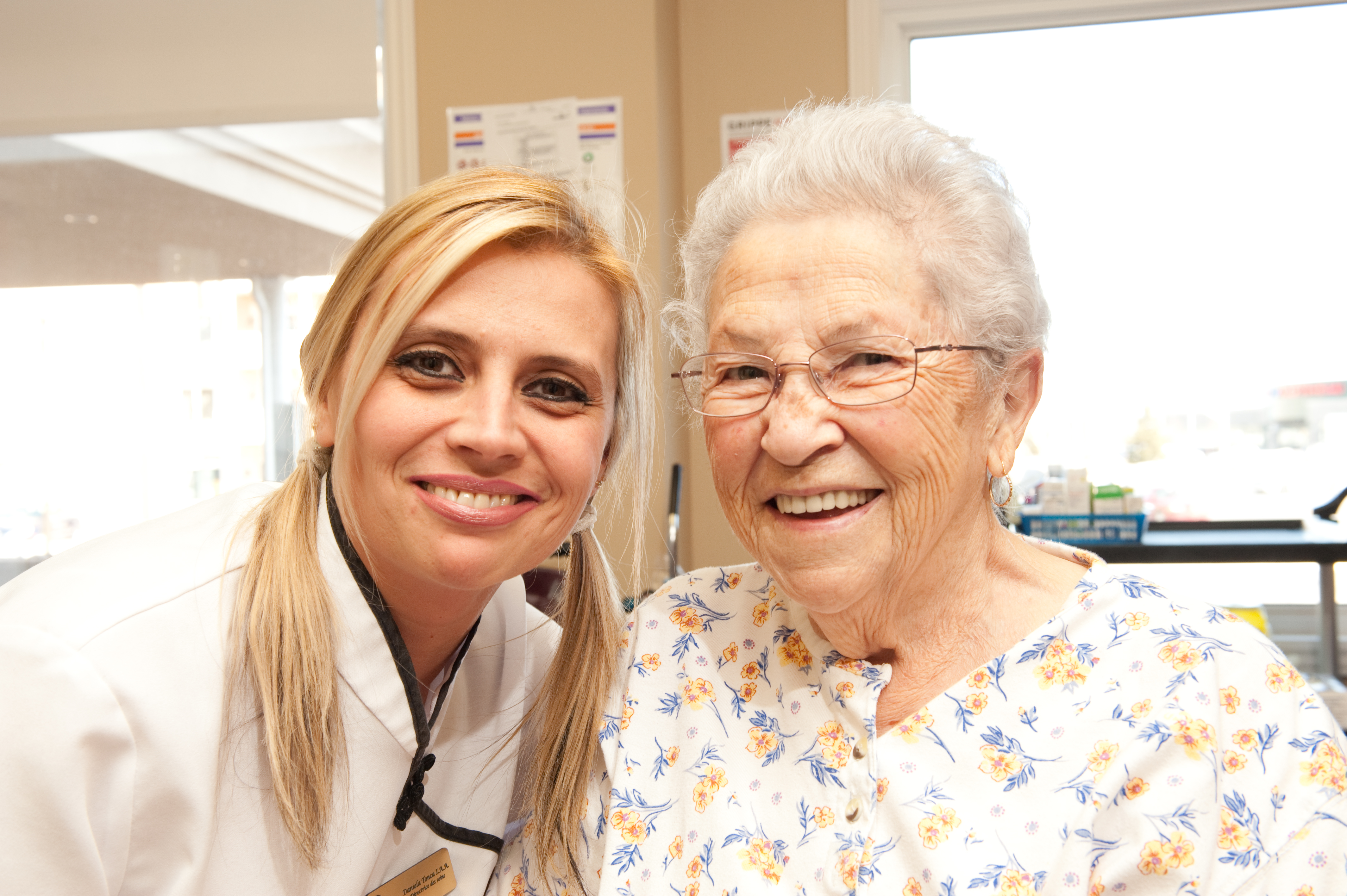 Caregiver and Older Woman in a health-care environment